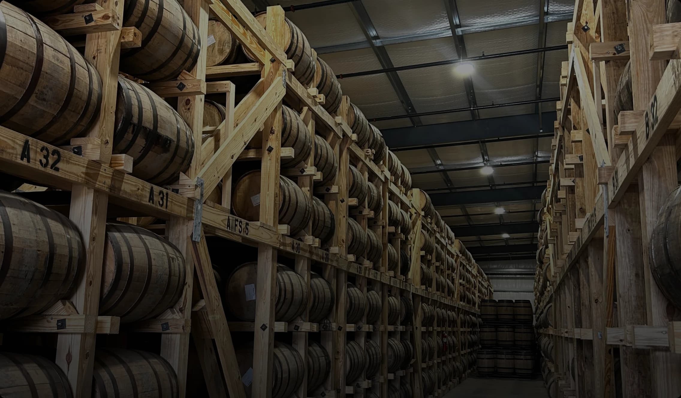 whiskey barrels in storage